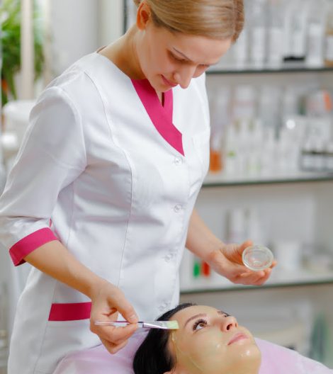 professional-woman-applying-green-cream-with-brush professional-woman-applying-green-cream-with-brush