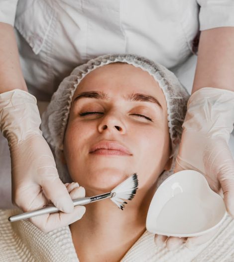 top-view-young-beautiful-woman-getting-face-skin-treatment top-view-young-beautiful-woman-getting-face-skin-treatment