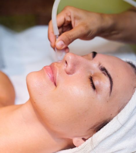 young-woman-lying-cosmetologist-s-table-during-rejuvenation-procedure young-woman-lying-cosmetologist-s-table-during-rejuvenation-procedure